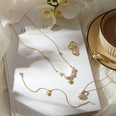 Gold Shell Pearl Interlock Oval Hoop Earrings