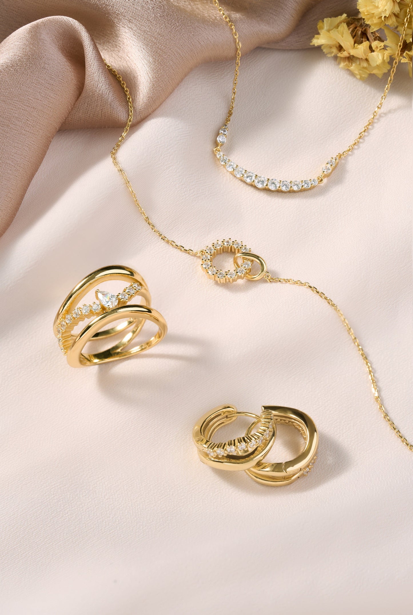 Gold Interlinked Circles Pavé Necklace styled with modern fashion accessories
