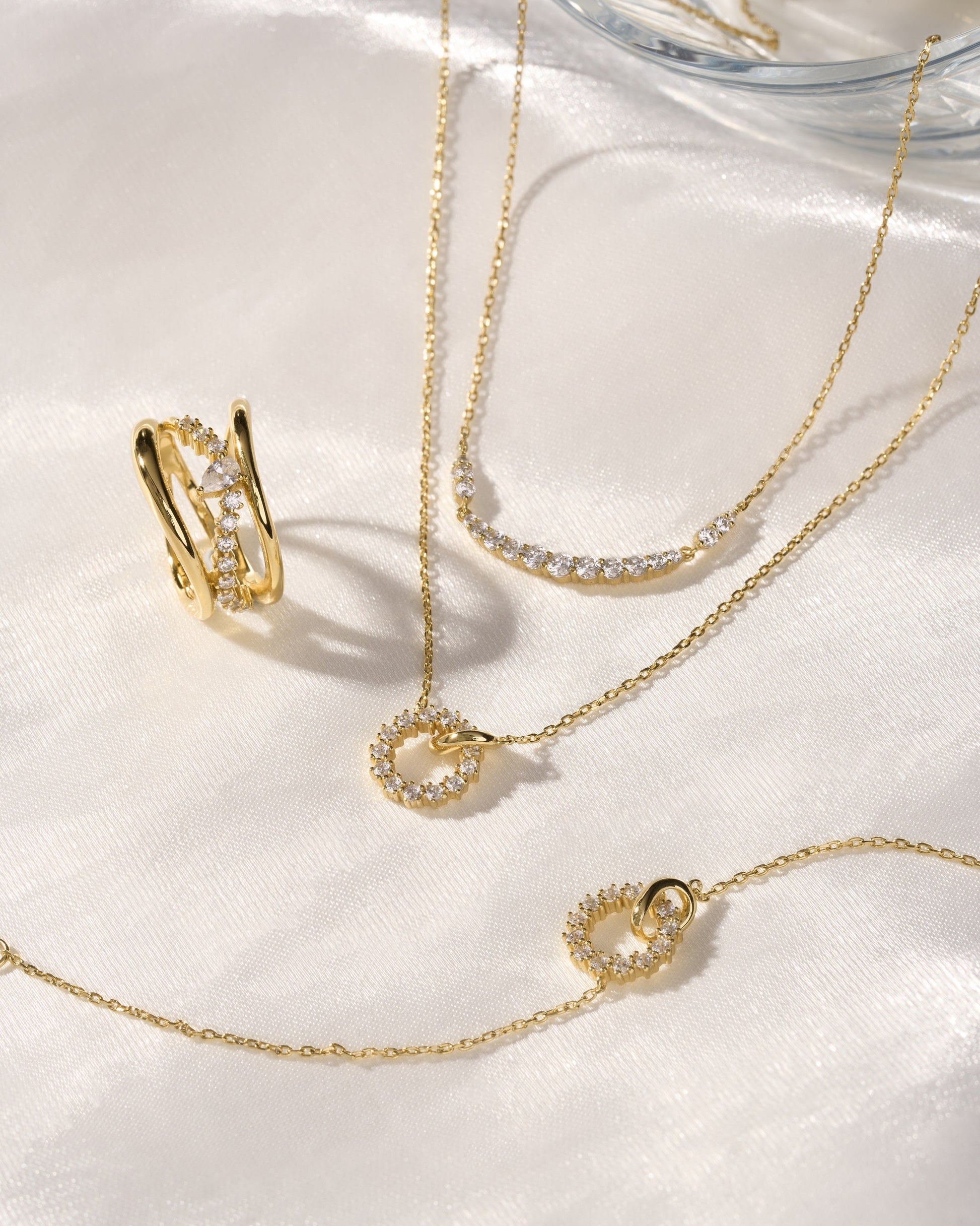 Ania Haie Gold Interlinked Circles Pavé Necklace displayed in an elegant jewellery styling scene